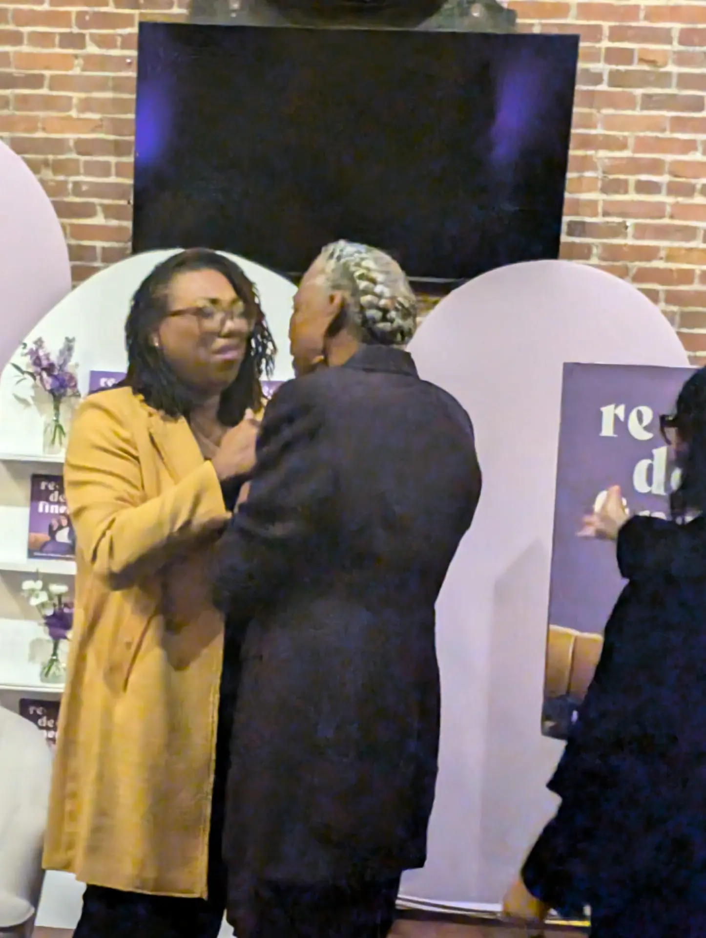 LaKeysha Cobbs-Hayes greeting Mrs. Brown at the Redefined book launch