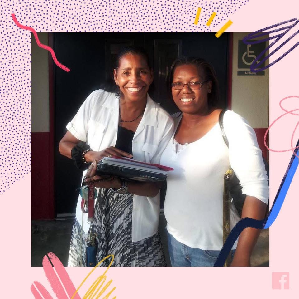 LaKeysha Cobbs-Hayes standing with Mrs. Brown outside a school doorway, both smiling